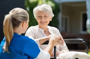 depositphotos 211965946 stock photo smiling senior patient sitting wheelchair